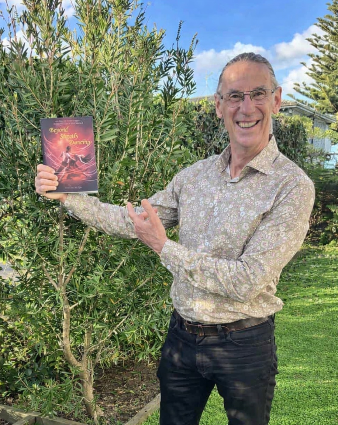 Peter van der Veek holding a copy of Beyond Strictly Dancing